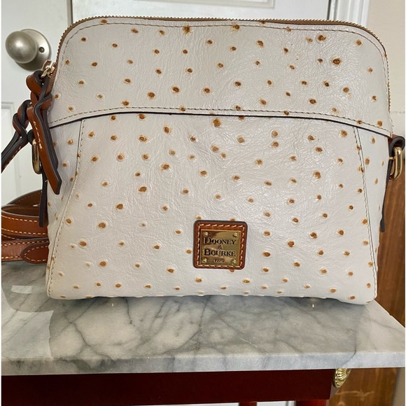 Dooney & Bourke Handbags - Dooney & Bourke White Ostrich Leather purse.
Brand new condition only used once.